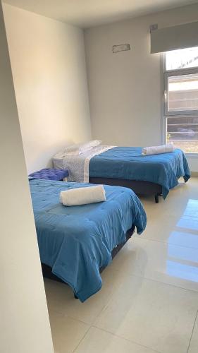 Ένα ή περισσότερα κρεβάτια σε δωμάτιο στο Alquilo casa amueblada en centenario