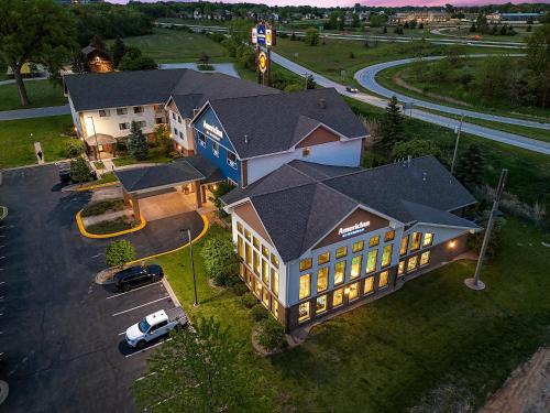 an overhead view of a large building with a parking lot at AmericInn by Wyndham Green Bay East in Green Bay
