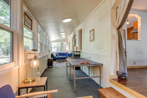 a living room with a table and a couch at Wine Country Cottage in Historic Fiddletown! in Fiddletown