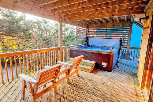 a porch with a bed and two chairs on a deck at Idle Minds 84 in Salvo