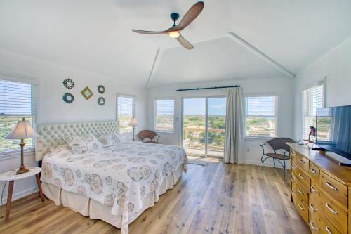 a bedroom with a bed and a ceiling fan at Last Mango in Hatteras 191 in Avon