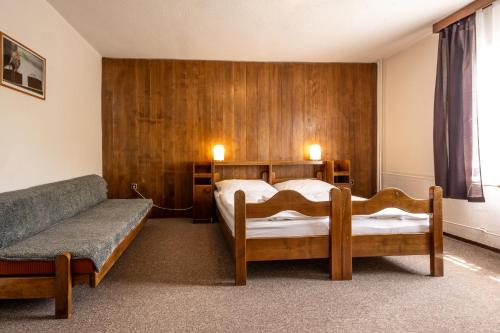 Ένα ή περισσότερα κρεβάτια σε δωμάτιο στο Hotel Tanecnica