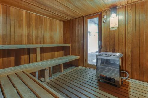 an empty sauna with a bench and a window at Sugar Top Condos II in Sugar Mountain