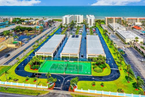 an aerial view of a tennis court in front of the ocean at Sand Castle Paradise in Cocoa Beach