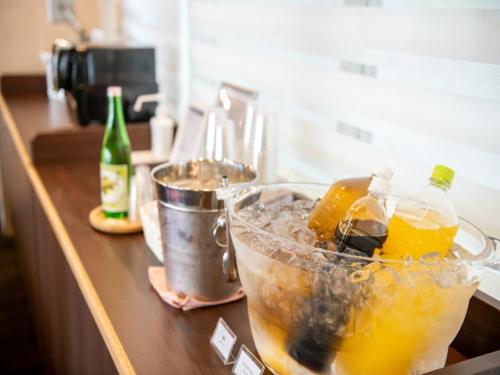 a counter top with a bowl of drinks on it at Smile Hotel Kushiro - Vacation STAY 69842v in Kushiro
