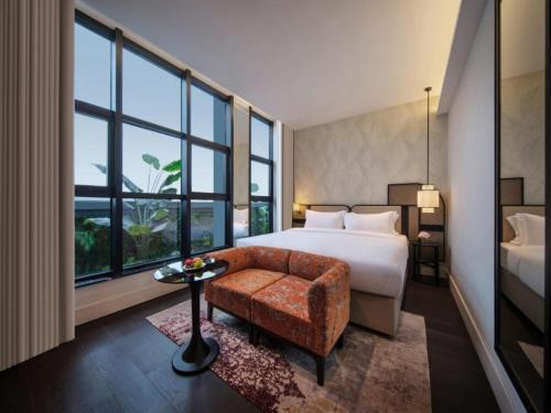 a hotel room with a bed and a large window at Chongqing KS Kongshang Hotel in Chongqing
