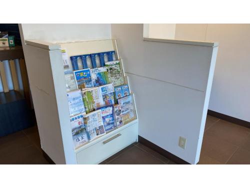 a refrigerator filled with lots of books at Smile Hotel Sendai Tagajyo - Vacation STAY 84225v in Tagajo