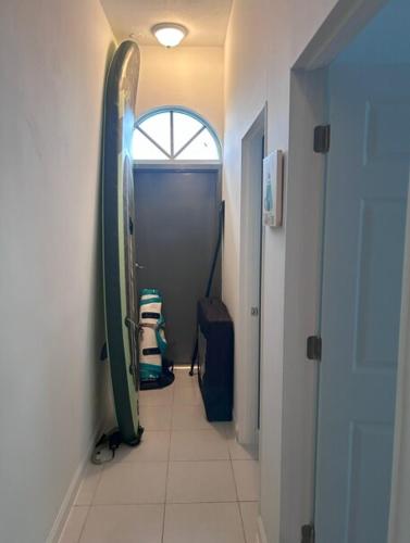 a hallway with surfboards on the wall in a room at Hagat Sunset Retreat in Agat