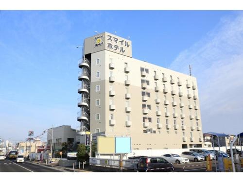 a large building with cars parked in a parking lot at Smile Hotel Shiogama - Vacation STAY 84469v in Shiogama