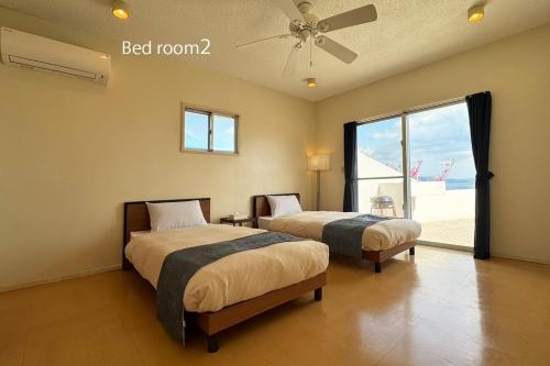 En eller flere senge i et værelse på Ishikawa Kona Garden - Vacation STAY 90793v