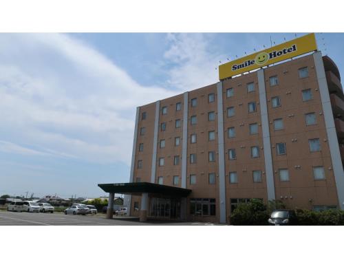 a hotel building with a sign on top of it at Smile Hotel Shizuoka Yoshida Inter - Vacation STAY 90880v 