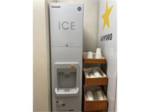 a ice machine with baskets of toilet paper at Smile Hotel Sasebo - Vacation STAY 92157v in Sasebo