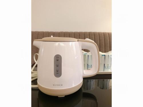 a white electric mixer sitting on a table at Smile Hotel Sasebo - Vacation STAY 92157v in Sasebo