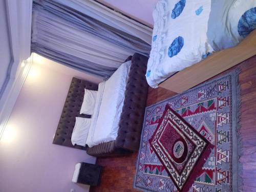 a pair of beds in a room at إثيوبيا أديس in Addis Ababa