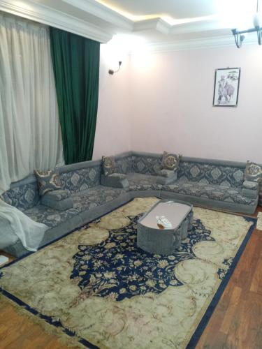 a living room with a couch and a rug at إثيوبيا أديس in Addis Ababa