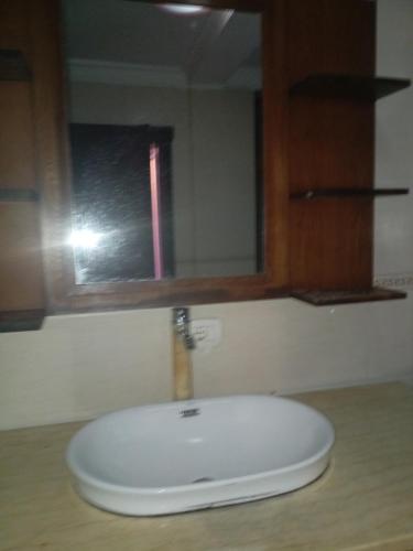 a white sink in a bathroom with a window at إثيوبيا أديس in Addis Ababa