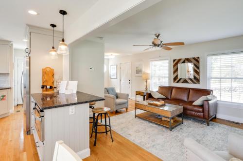 a kitchen and living room with a couch and a table at Walk to Pawcatuck River Family-Friendly Home! in Pawcatuck