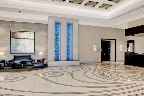 a lobby with a large rug on the floor at Mgm 1 Bedroom Balcony And Or Studio Luxury Suites in Las Vegas