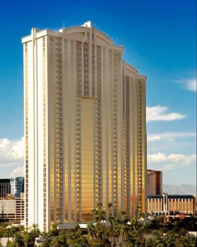 a large tall building in the middle of a city at Mgm 1 Bedroom Balcony And Or Studio Luxury Suites in Las Vegas