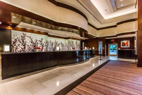 a lobby with a bar in a hotel at Mgm 1 Bedroom Balcony And Or Studio Luxury Suites in Las Vegas