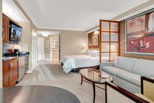 a large living room with a bed and a couch at Mgm 1 Bedroom Balcony And Or Studio Luxury Suites in Las Vegas
