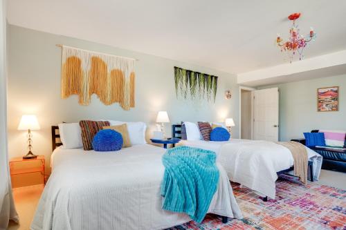 two beds in a bedroom with blue and white at Mid-Century Escape 7 BR Sleeps 22 Hot Tub & Games in Westminster