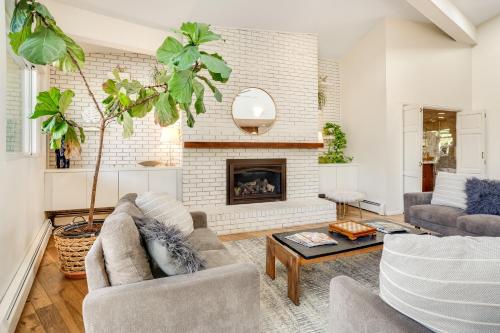 a living room with a couch and a fireplace at Mid-Century Escape 7 BR Sleeps 22 Hot Tub & Games in Westminster