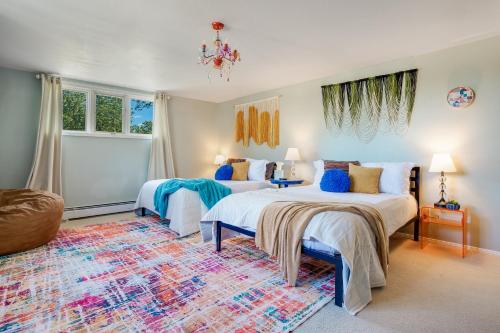 a bedroom with two beds and a rug at Mid-Century Escape 7 BR Sleeps 22 Hot Tub & Games in Westminster