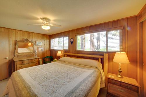a bedroom with a bed and a mirror at Private Sandy Beach Lake Superior Group Retreat in Marquette