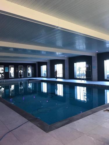 a large swimming pool in a building at CT12 The Beach Hut in Rhyl