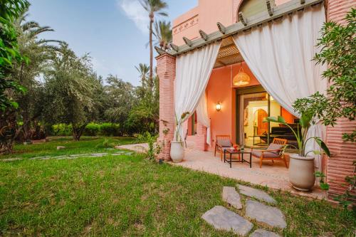 Aed väljaspool majutusasutust Palmeraie, Jardin et Piscine