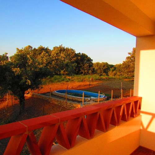 a balcony with a view of a swimming pool at Eira Velha in Portalegre