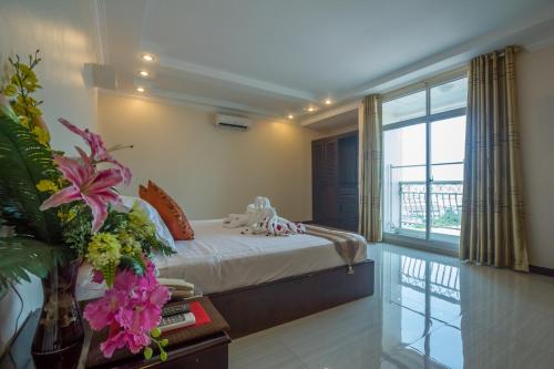 Katil atau katil-katil dalam bilik di Good Luck Day Hotel & Apartment