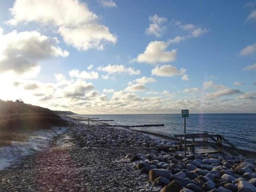 a group of rocks on a beach near the water at 10 person holiday home in Græsted-By Traum in Græsted