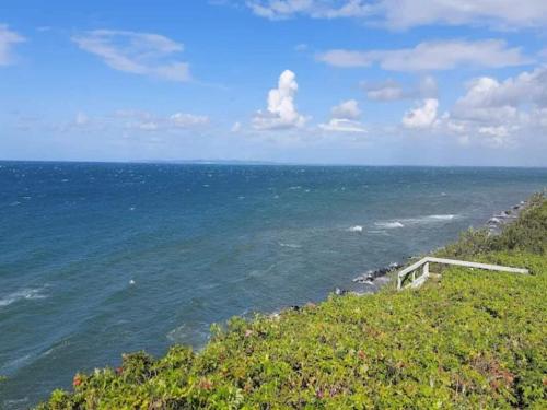 a view of the ocean from a hill with a beach at 6 person holiday home in Gilleleje-By Traum in Gilleleje