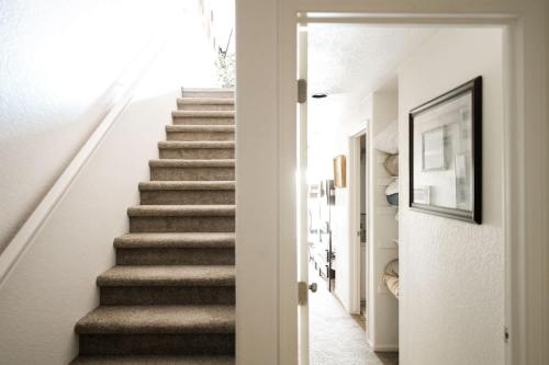 a staircase in a home with white walls at Explore Relax Repeat - Riverside Views - Eagle in Eagle