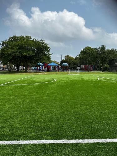 a green soccer field with a playground in the background at Luxury Penthouse -3 Blocks to Boardwalk, Outlets, & Casinos - Near AtlantiCare in Atlantic City
