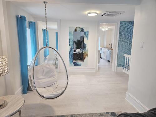 a room with a round mirror hanging from the ceiling at Luxury Penthouse -3 Blocks to Boardwalk, Outlets, & Casinos - Near AtlantiCare in Atlantic City