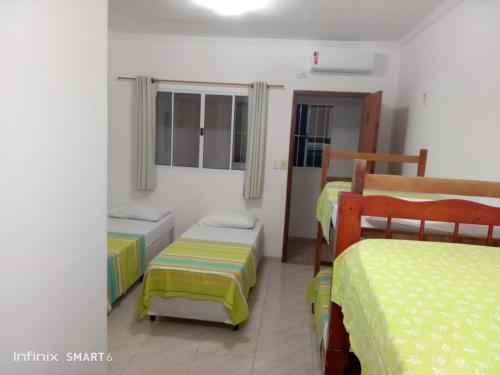 En eller flere senge i et værelse på POUSADA SÃO MATHEUS - Casa e Hospedagem