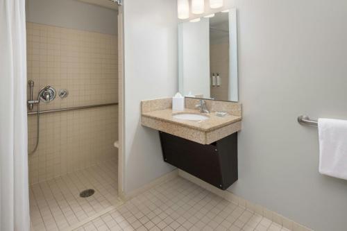 a bathroom with a sink and a shower at TownePlace Suites by Marriott Lancaster in Lancaster