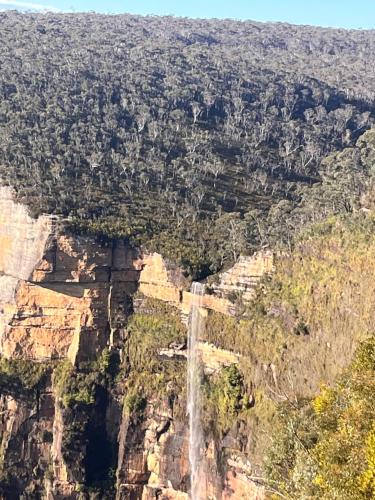 an aerial view of a waterfall on the side of a mountain at Serenity in Lithgow