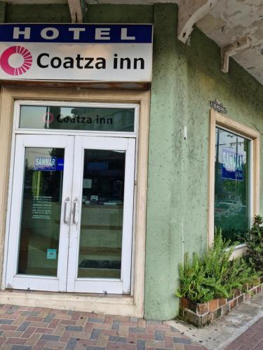 a hotel entrance with a sign above a door at Hotel Coatza Inn in Coatzacoalcos