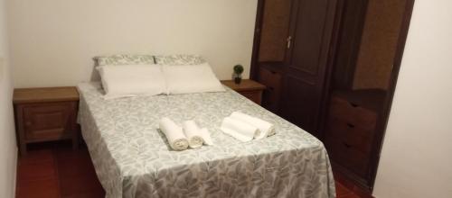 En eller flere senge i et værelse på Casa Ladino no Campo