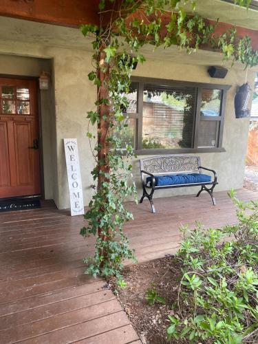 a bench sitting on the porch of a house at The Legend Home in Oroville
