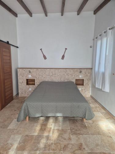 Postel nebo postele na pokoji v ubytování Chez didine
