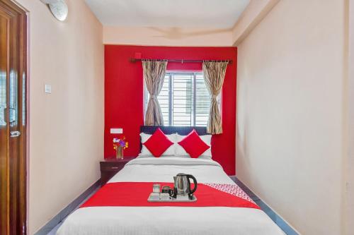 Postel nebo postele na pokoji v ubytování Hotel O Prasad Inn