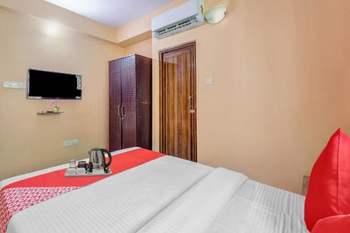Postel nebo postele na pokoji v ubytování Hotel O Prasad Inn