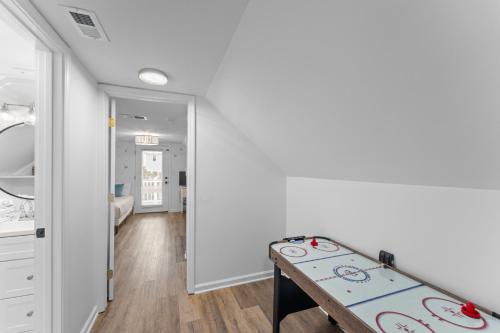 a room with a ping pong table in it at Ft Morgan Bama Belle-Beach Access in Gulf Shores