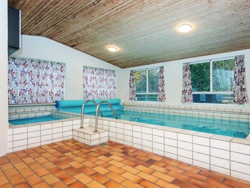 a large indoor swimming pool in a house at 10 person holiday home in Glesborg-By Traum in Glesborg