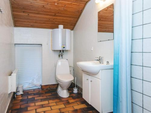 a bathroom with a toilet and a sink at 10 person holiday home in Glesborg-By Traum in Glesborg